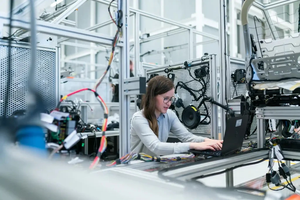 A person working in a manufacturing or lab setting.