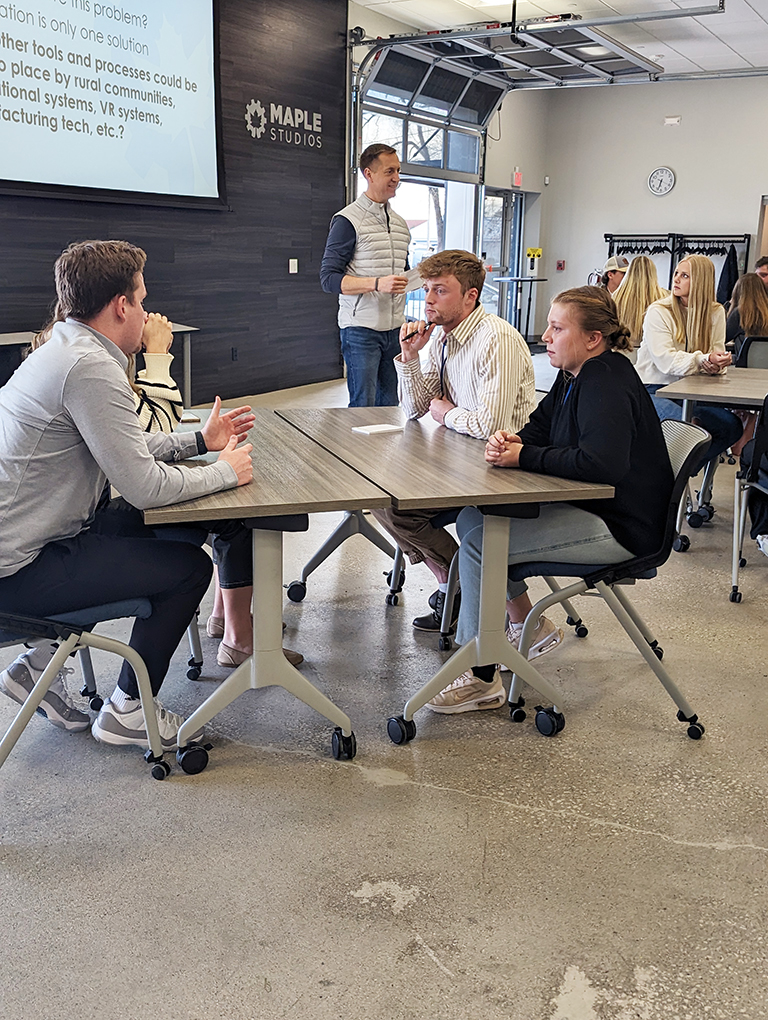 Students participate in a design challenge led by Hank Norem, CEO of Sukup Innovations, at Maple Studios in West Des Moines